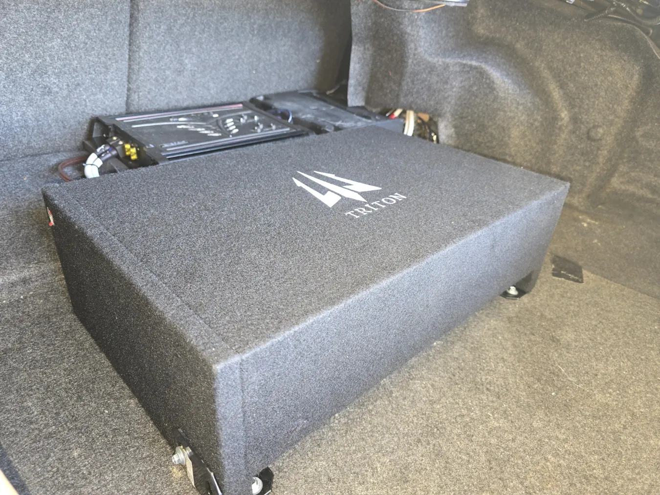 Subwoofer enclosure in a vehicle cargo area