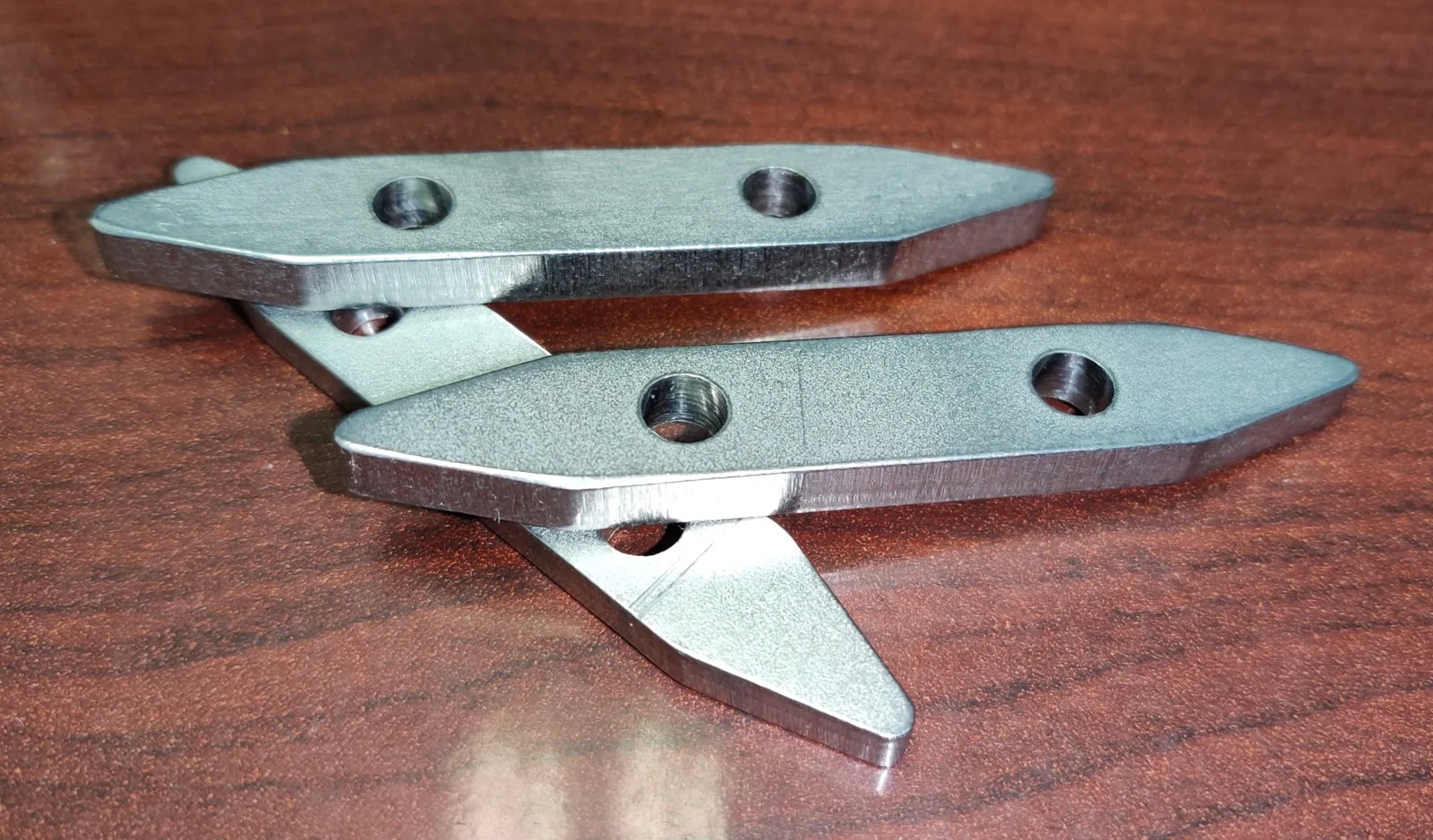 Finished fabricated and machined metal components with identifiable surface finish